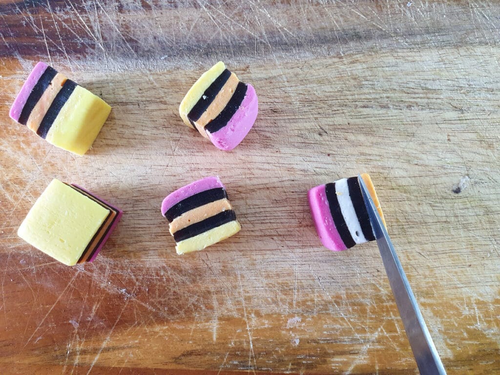 Cutting square candy down.