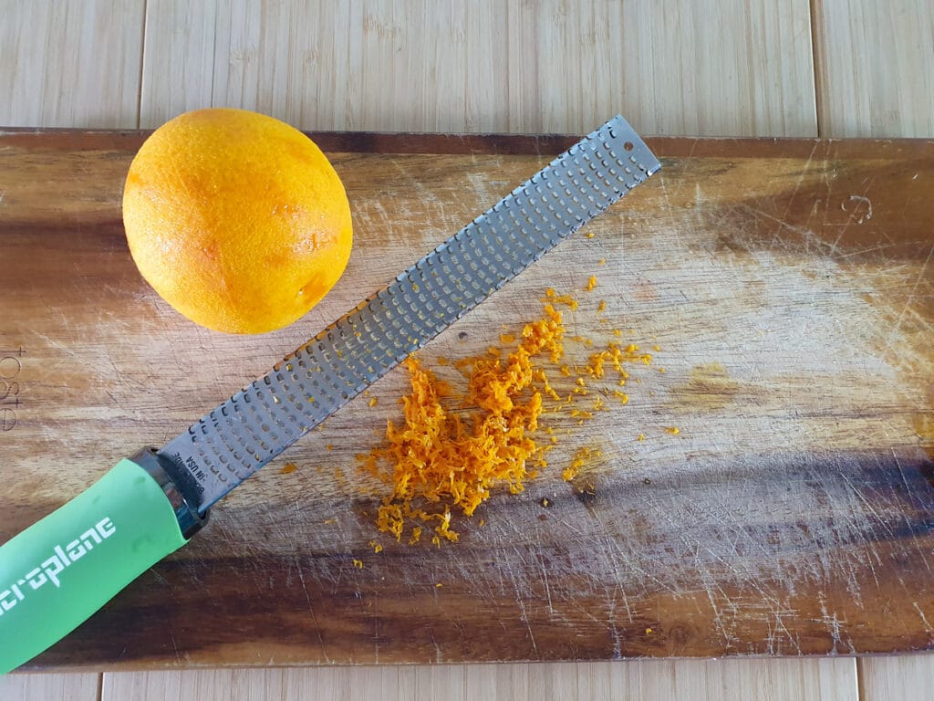 Zesting the oranges.