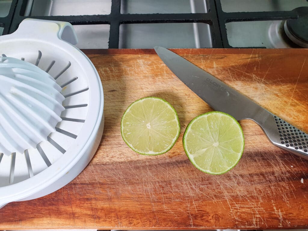 Slicing and juicing the fresh lime.