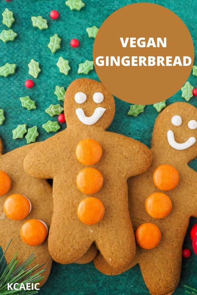 Gingerbread surrounded by sprinkles, with text overlay, vegan gingerbread and KCAEIC.