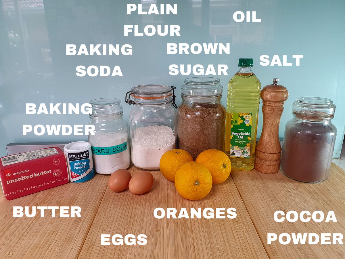 Ingredients: butter, baking powder, baking soda, eggs, plain flour, oranges, brown sugar, oil, salt, cocoa powder.,