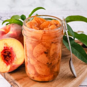 Peach compote 9 Compote in mason jar with spoon.