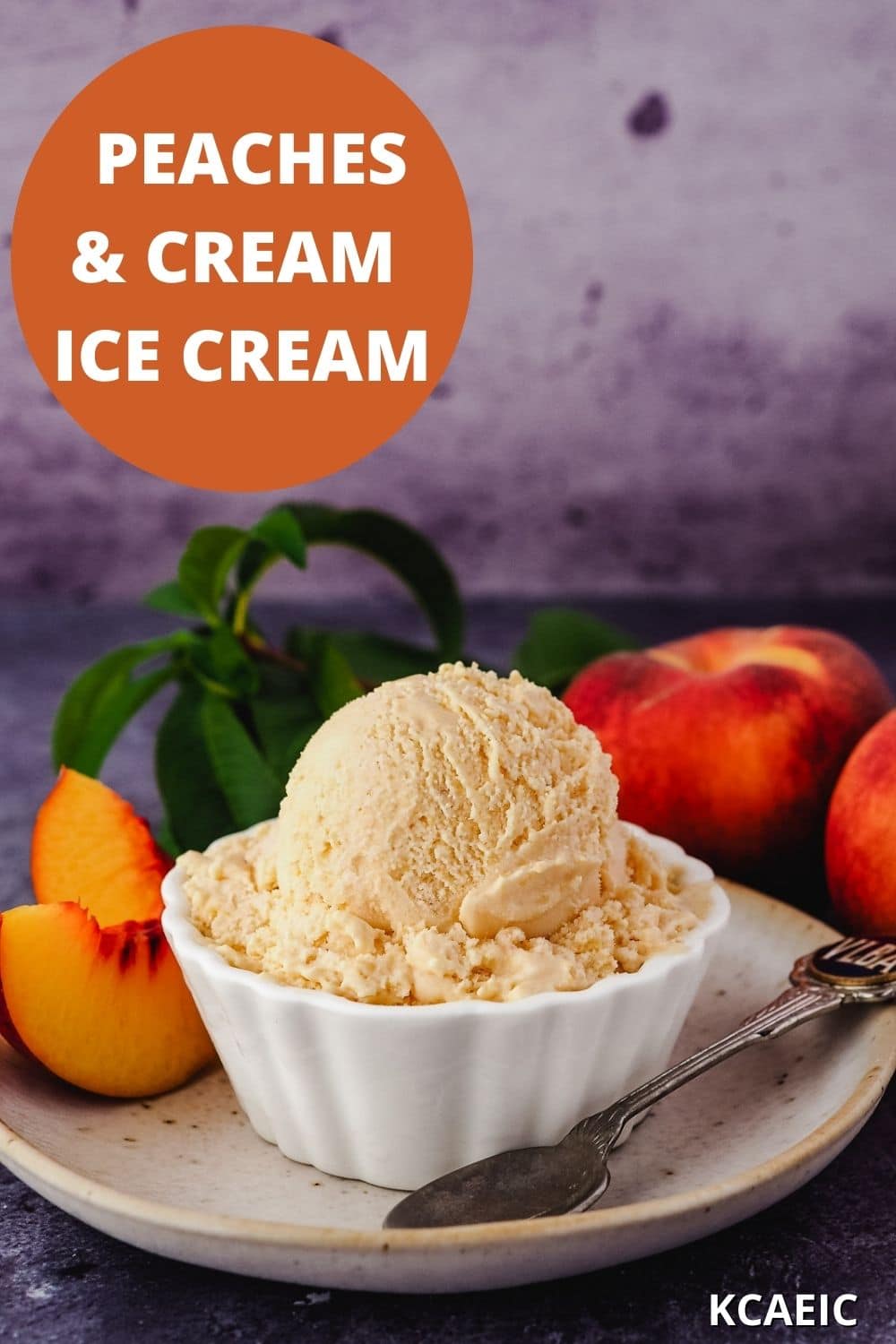 Scoop of ice cream in bowl with spoon, fresh peaches and text overlay, peaches and cream ice cream and KCAEIC.