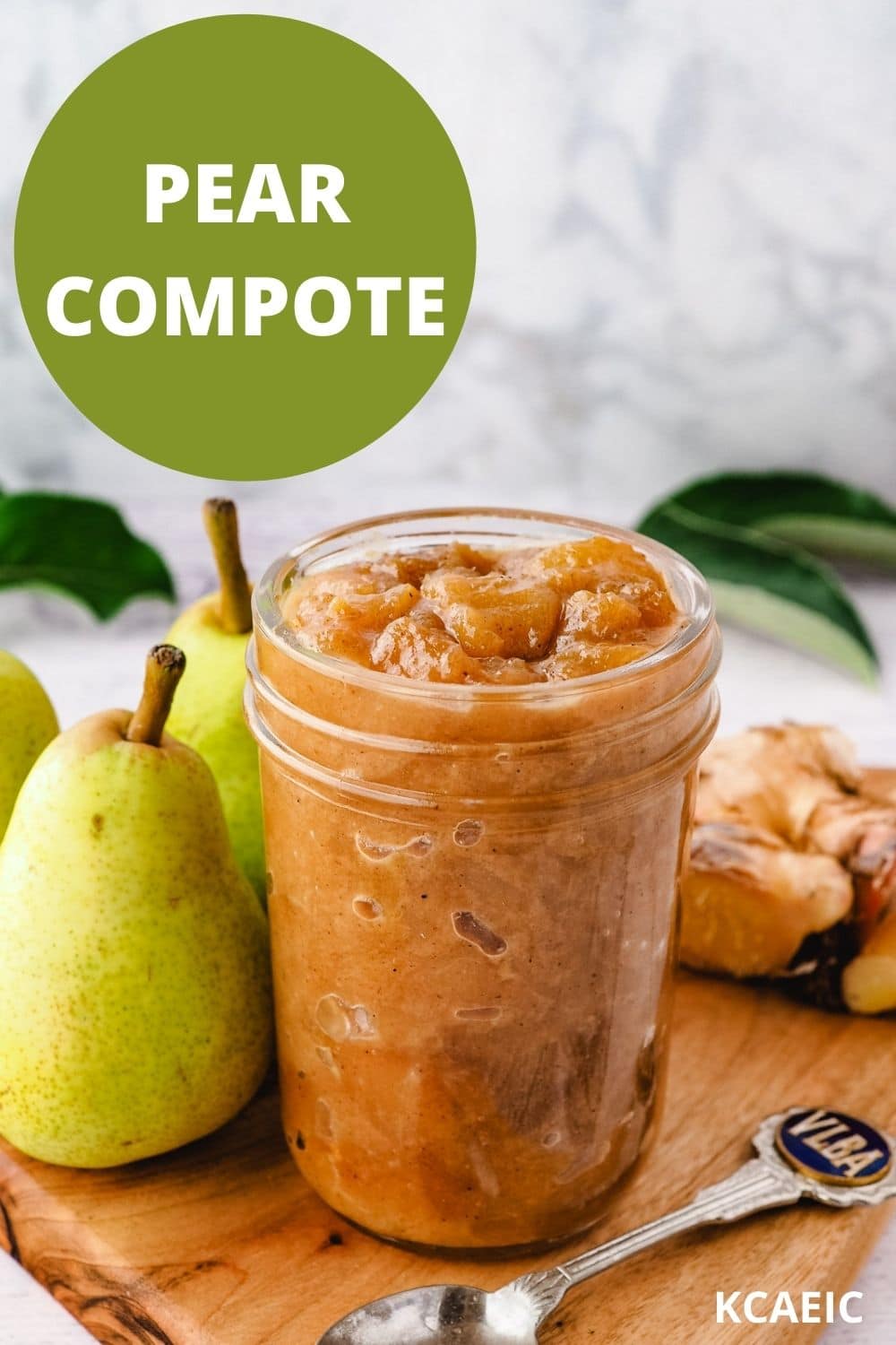 Mason jar of compote, with spoon and fresh pears and ginger on the side.