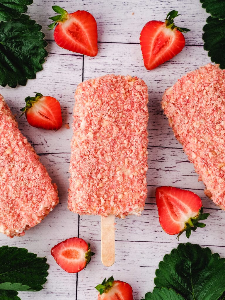 Strawberry Shortcake Ice Cream 13 Strawberry shortcake ice cream bar with fresh strawberries and leaves.