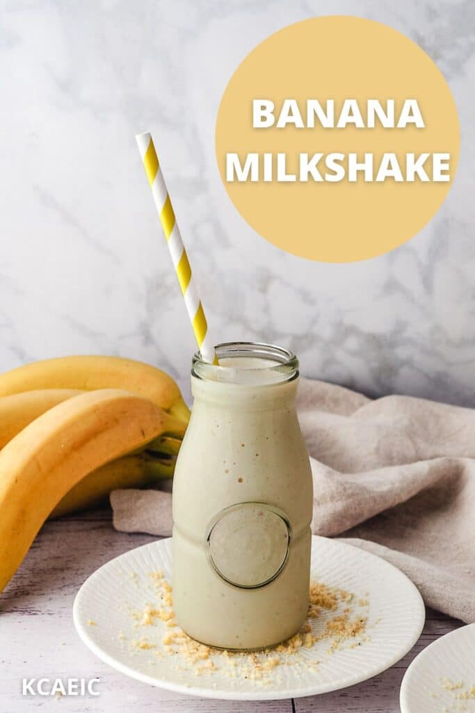 Milkshake in a glass jar with a straw, fresh bananas in the background and text overlay.