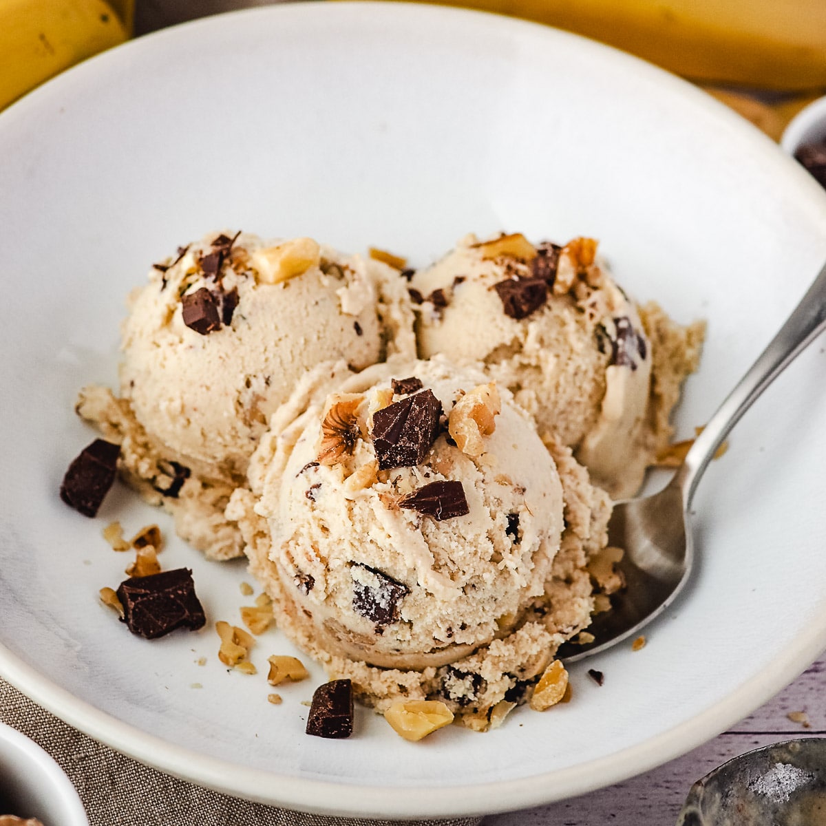 Close up of three scoops of ice cream in a bowl.