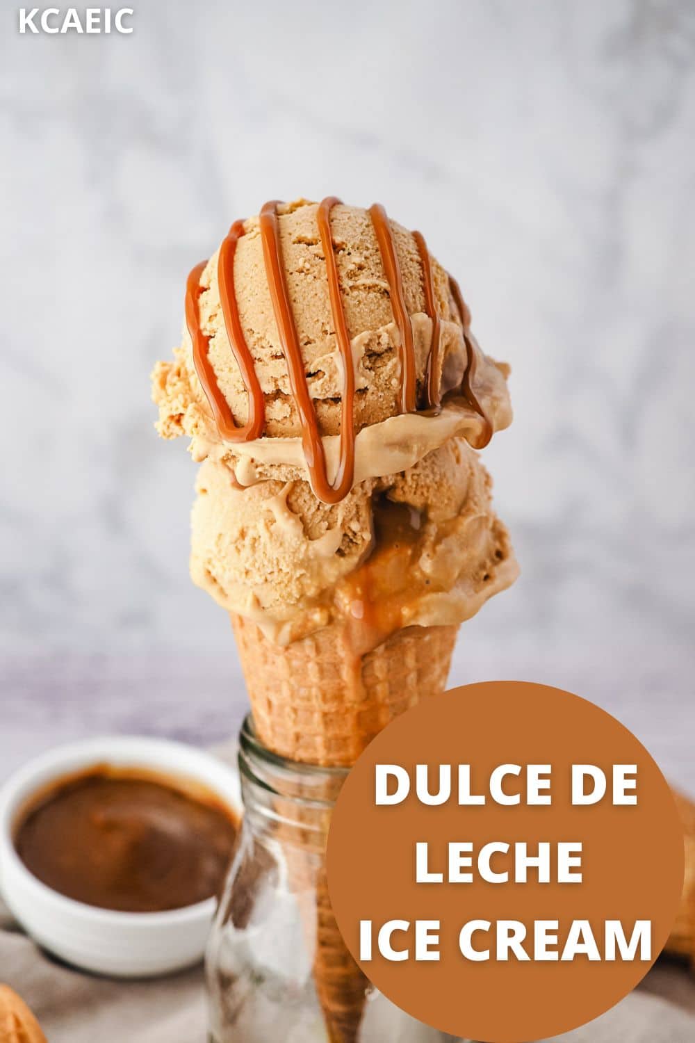 Dulce De Leche Ice Cream 10 Two scoops of ice cream in cone with dulce de leche drizzle and dulce de leche in background, with text overlay.