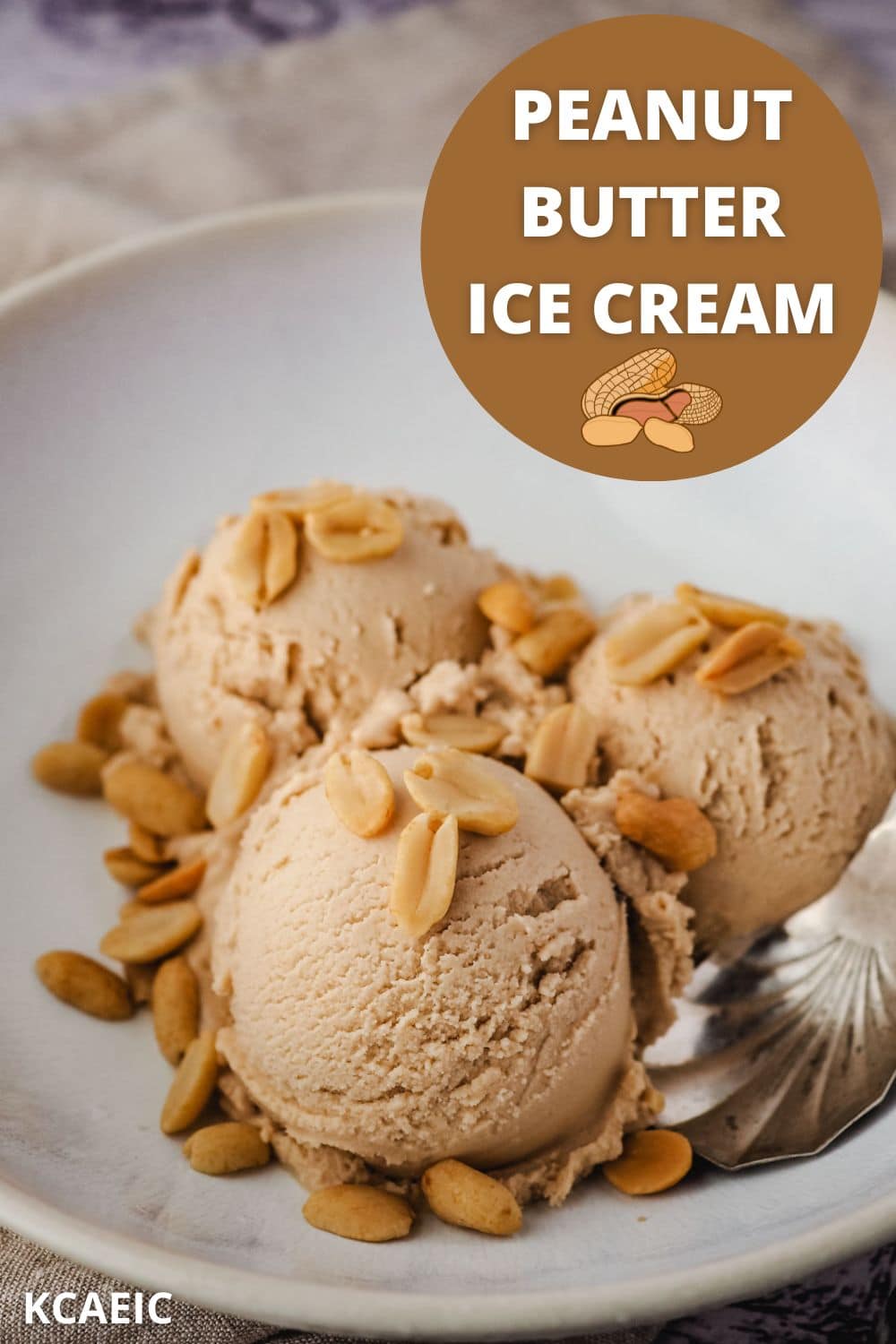 Peanut butter ice cream in a bowl with roasted peanuts, with text overlay.