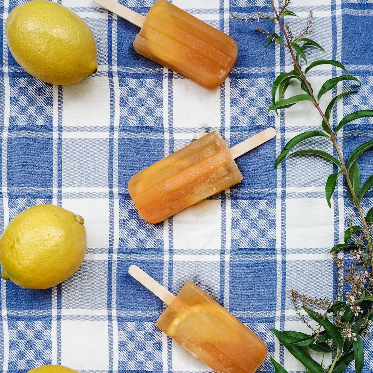 Lemon iced tea popsicles with fresh lemon and lemon verbena.