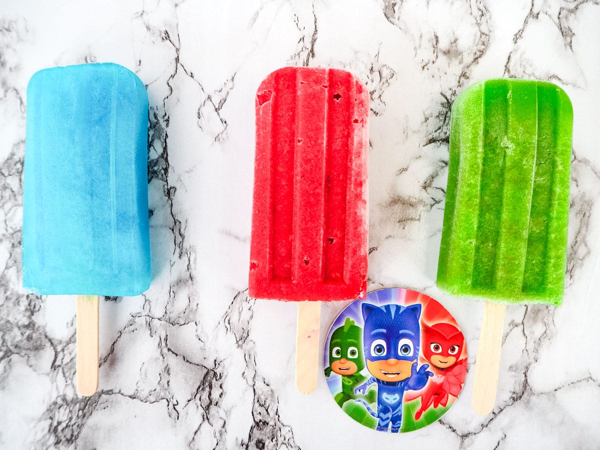 PJ Masks inspired popsicles 1 PJ Masks popsicles, blue lemonade, strawberry raspberry and green grape.