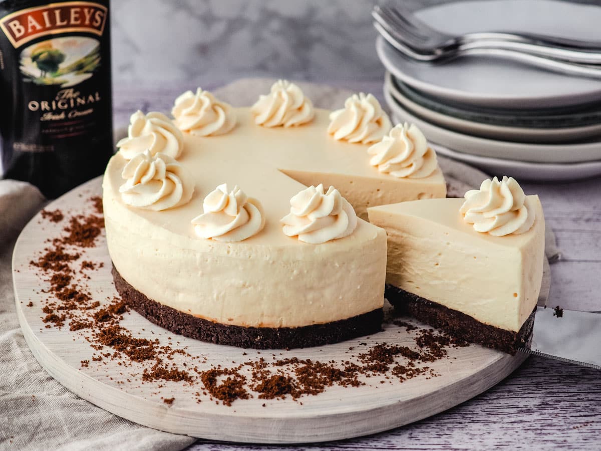 No Bake Cheesecake Recipes 9 Removing a slice of Baileys cheesecake.