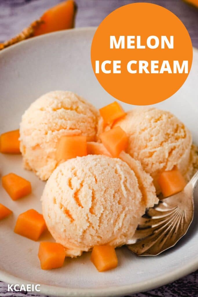 Three scoops of melon ice cream in a bowl, with a spoon and fresh melon pieces.