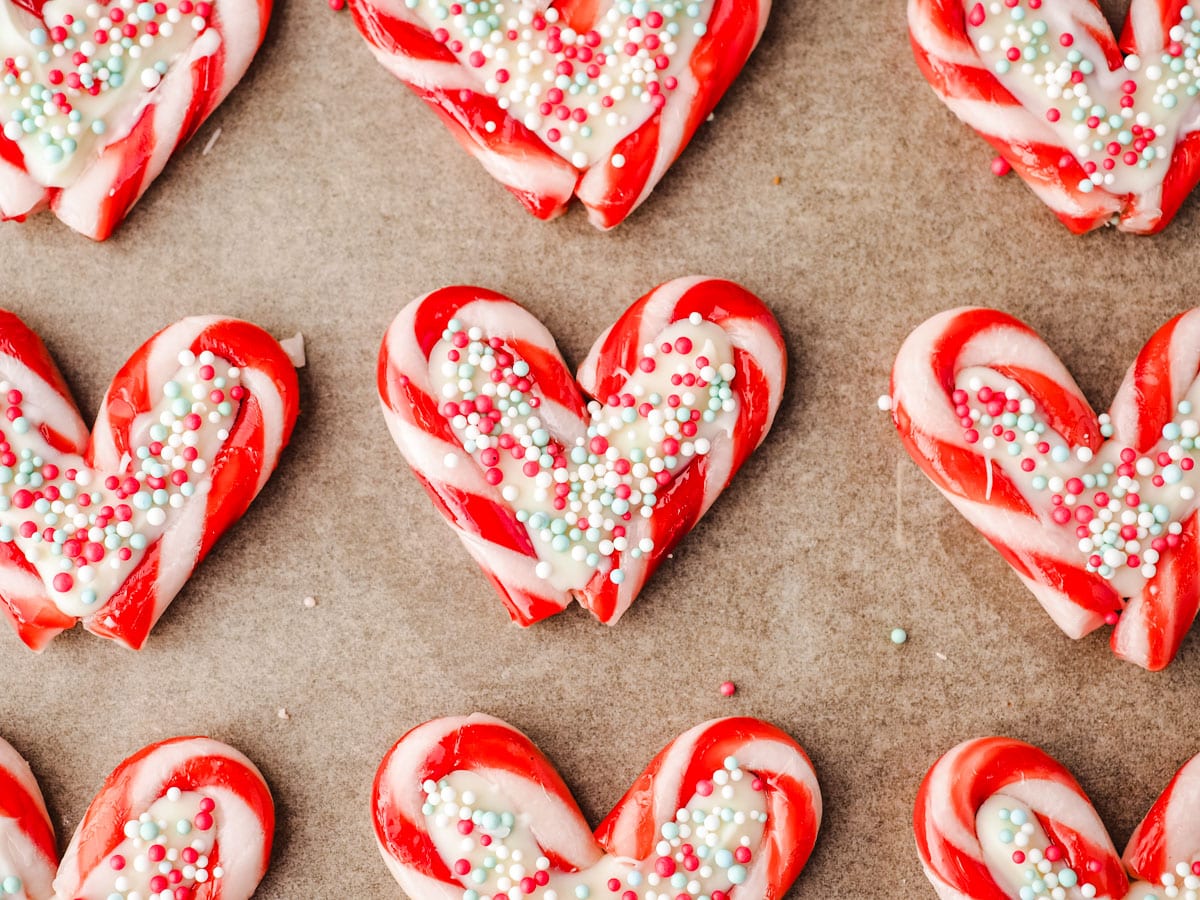 Candy cane hearts on parchment paper.