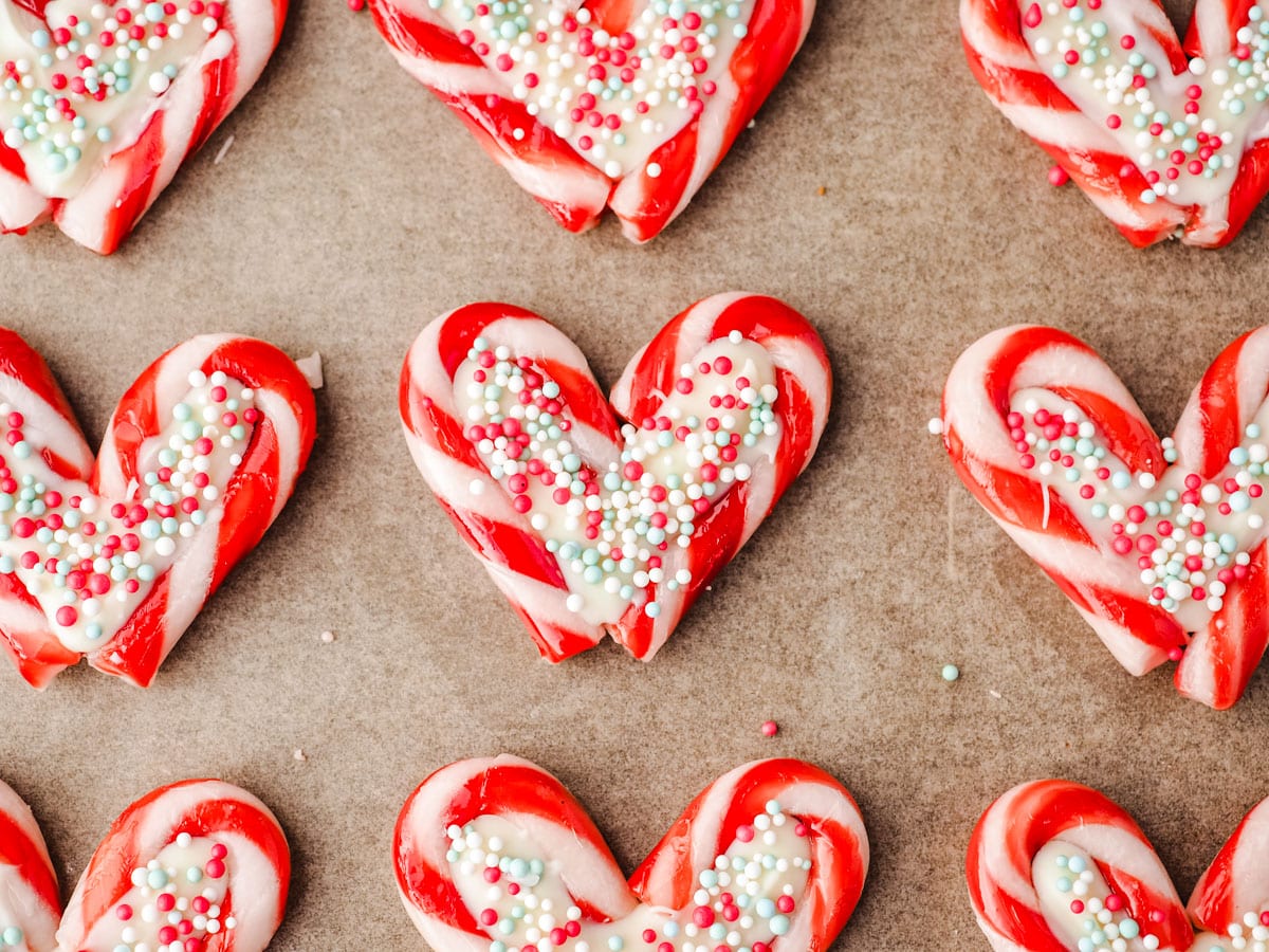 Candy Cane Hearts 8 Candy cane hearts on parchment paper.