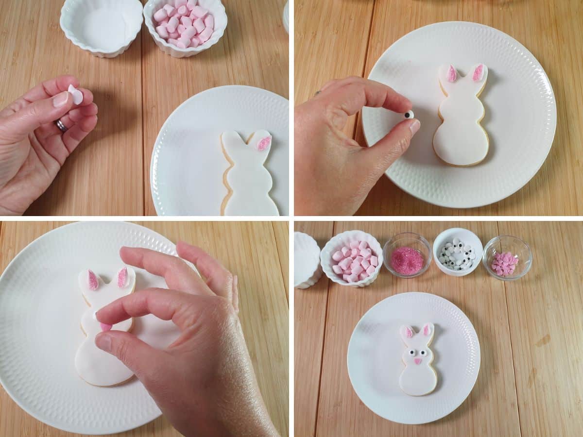 Decorating cookies: dabbing water onto flat side of marshmallows to stick onto fondant, repeating for candy eyes and heart for nose.