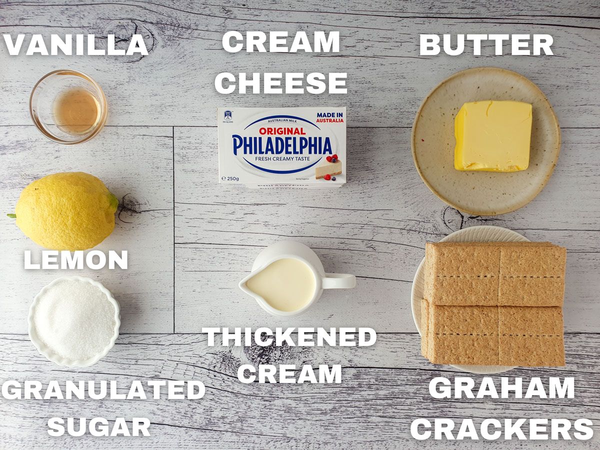 No bake cheesecake ingredients: vanilla extract, lemon, granulated sugar, cream cheese, thickened cream, butter, graham crackers.