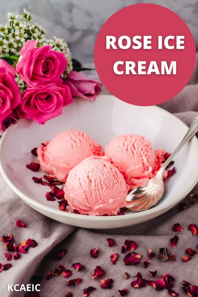 Scoops of rose ice cream in a bowl and a spoon on the side, garnished with rose petals and fresh roses in the background.