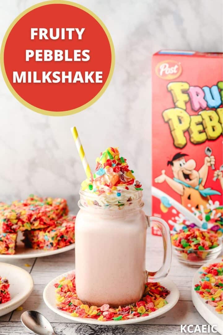 Fruity Pebbles milkshake in a glass with a striped straw, decorated with whipped cream and Fruity Pebbles, with a box of Fruity Pebbles and other Fruity Pebbles desserts in the background, with text overlay.
